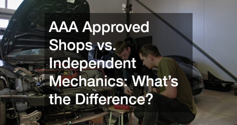 two auto mechanics collaborating to repair a car
